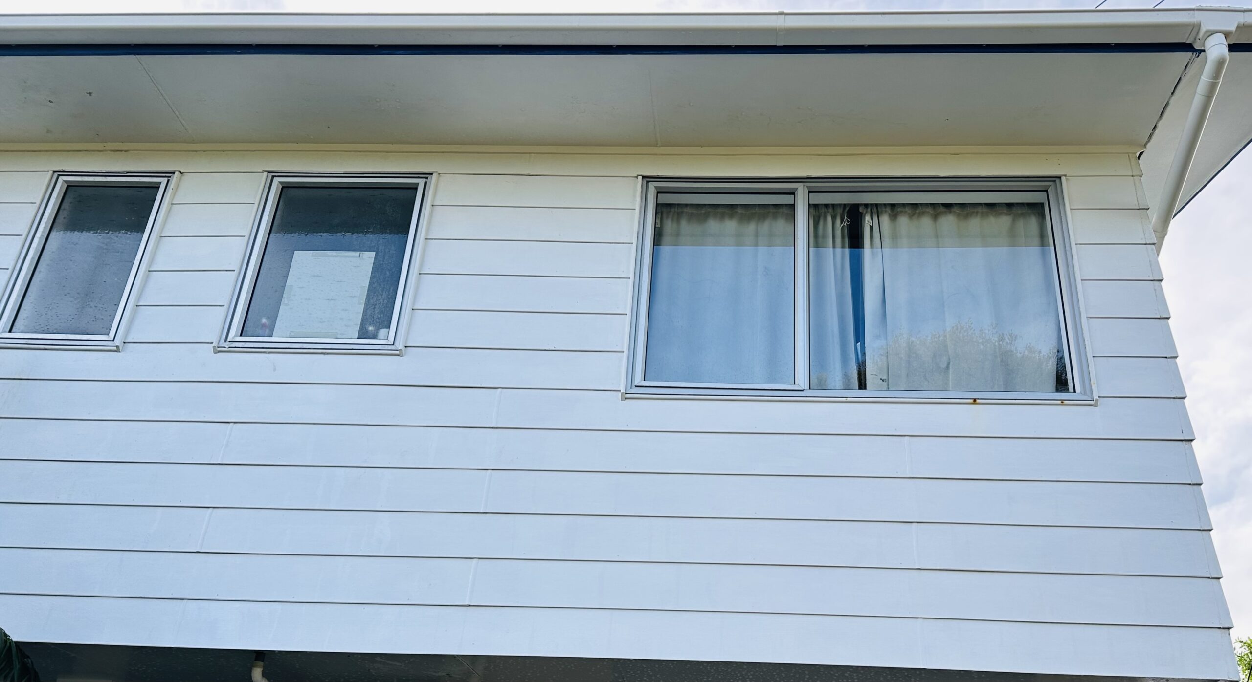 House exterior with weatherboard cladding after soft wash cleaning