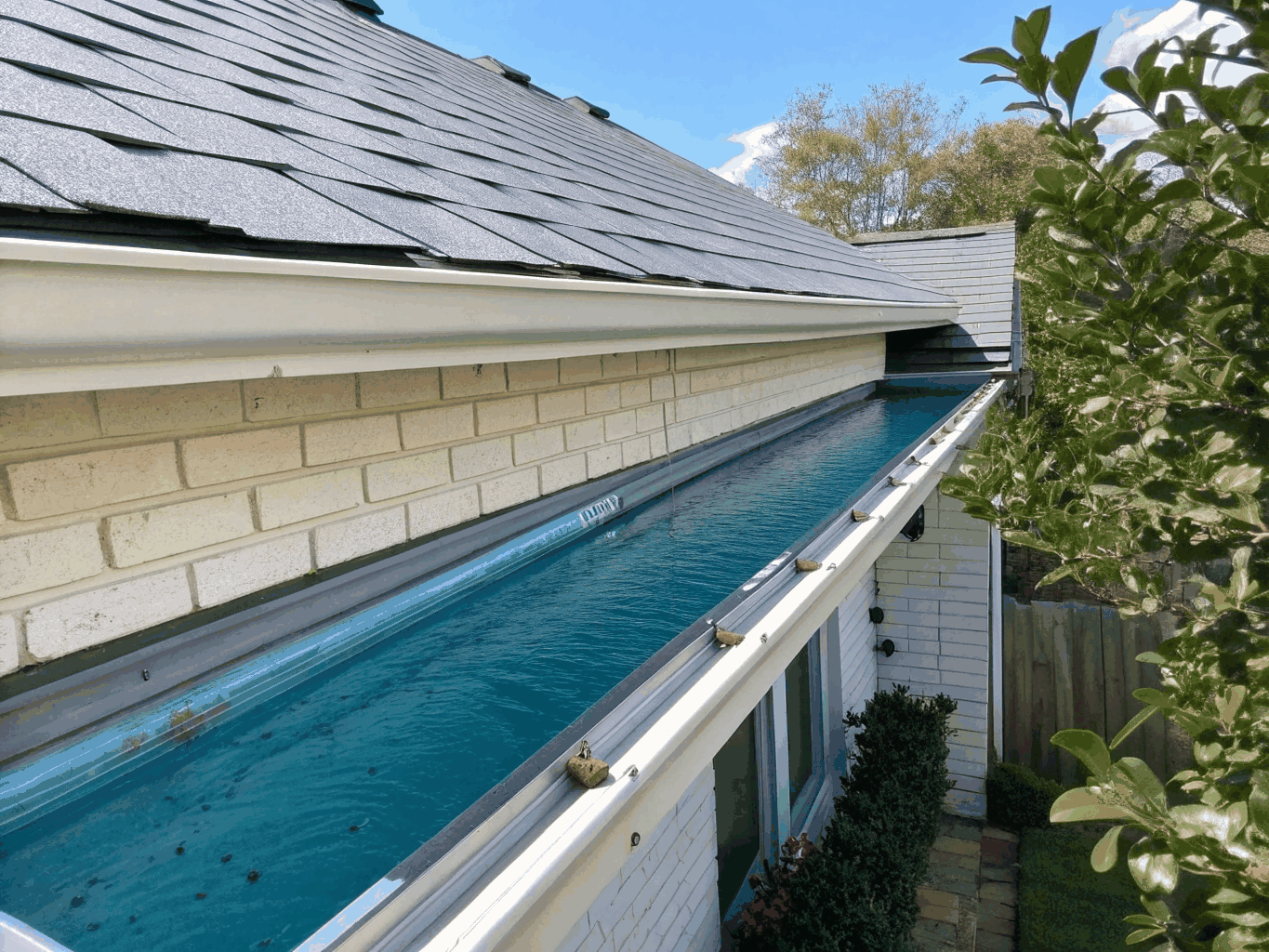 Cleared and flowing rainwater gutters on a suburban home